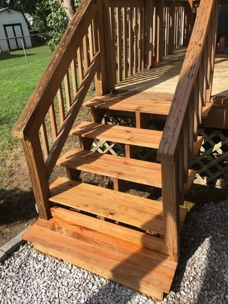 Deck stairs are stained are ready for use.